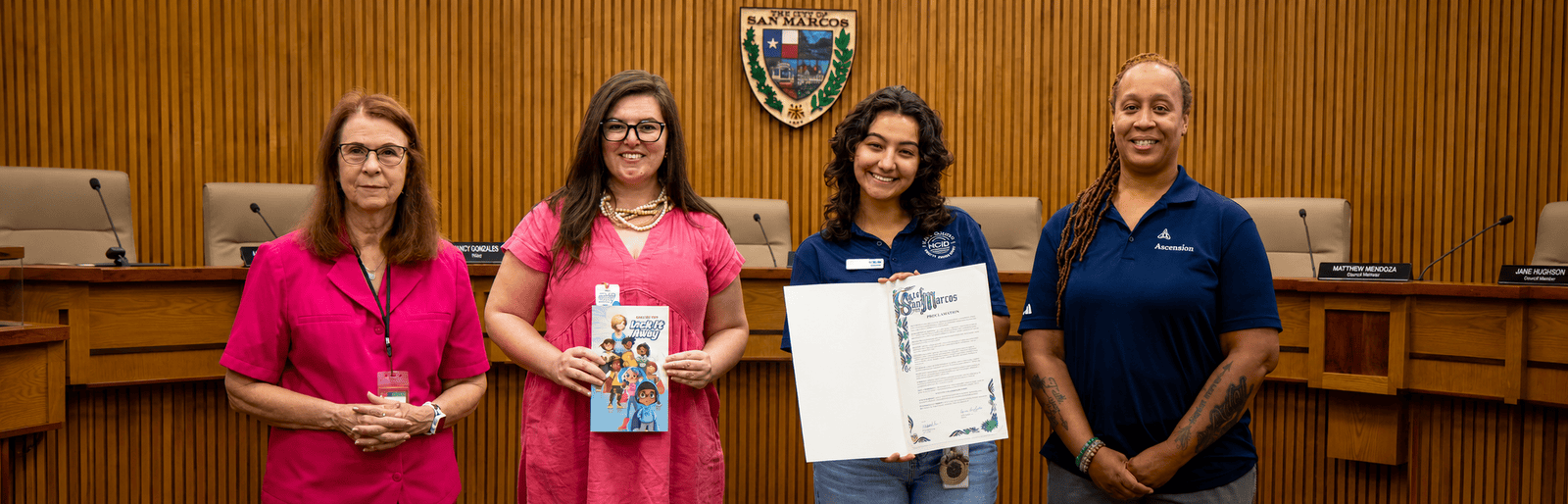 Community advocates presenting a Gun Safety Awareness Month proclamation at San Marcos City Hall