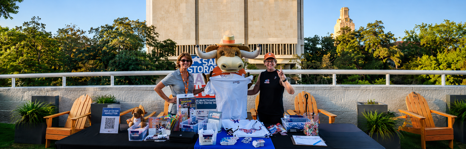 Lock Arms for Life firearm safety outreach table at a University of Texas community event