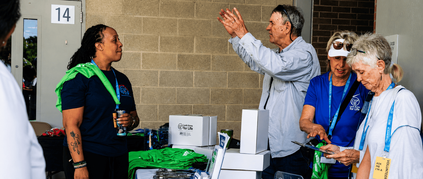Lock Arms for Life volunteers sharing safe storage resources with community members - Pat and LaPorshia